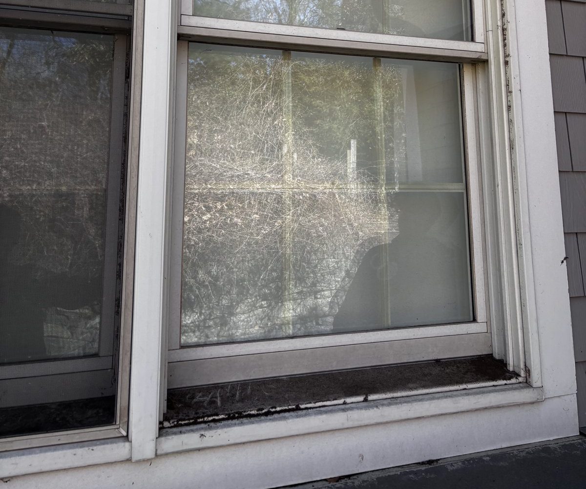 Very dirty windows with heavy buildup of grime and dust